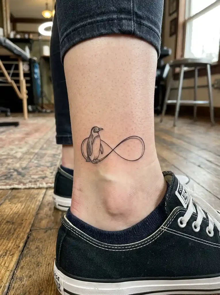 9. Penguin Infinity Symbol Tattoo